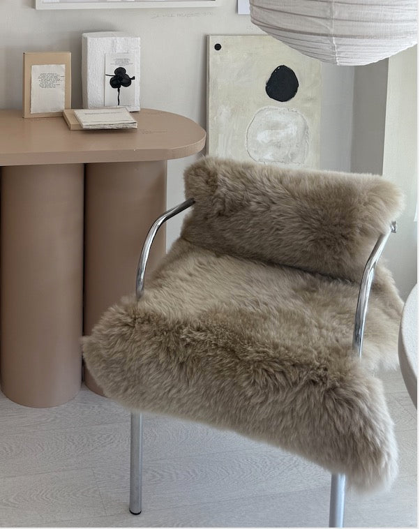 Retro silver armchair with camel wool sheepskin.