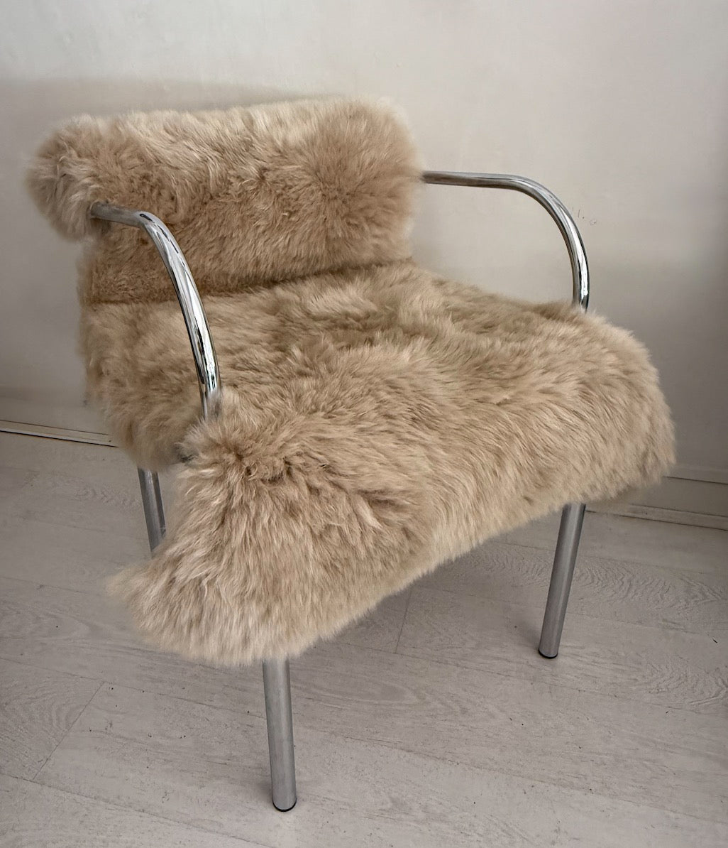 Retro silver armchair with camel wool sheepskin.
